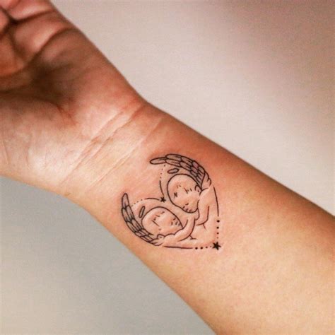 tatuajes de angelitos bebes para mujer|Tiernos tatuajes de angeles bebes para mujeres